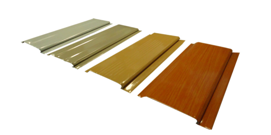 Spandrel ceiling panels made of pre-painted galvanized steel in multiple colors and wood finishes used for soffits, eaves, and ceiling applications
