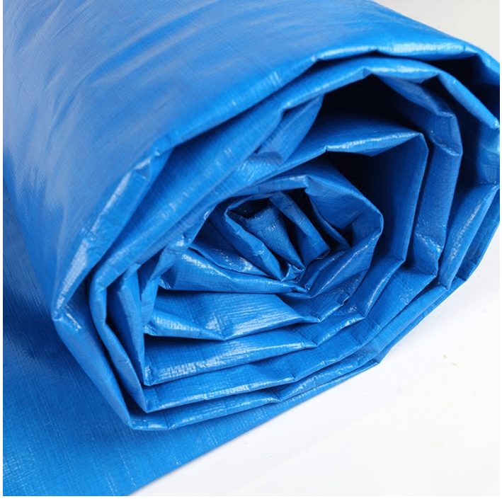 Woven laminated polypropylene sacks in blue and red used for construction covering, storage, and material protection